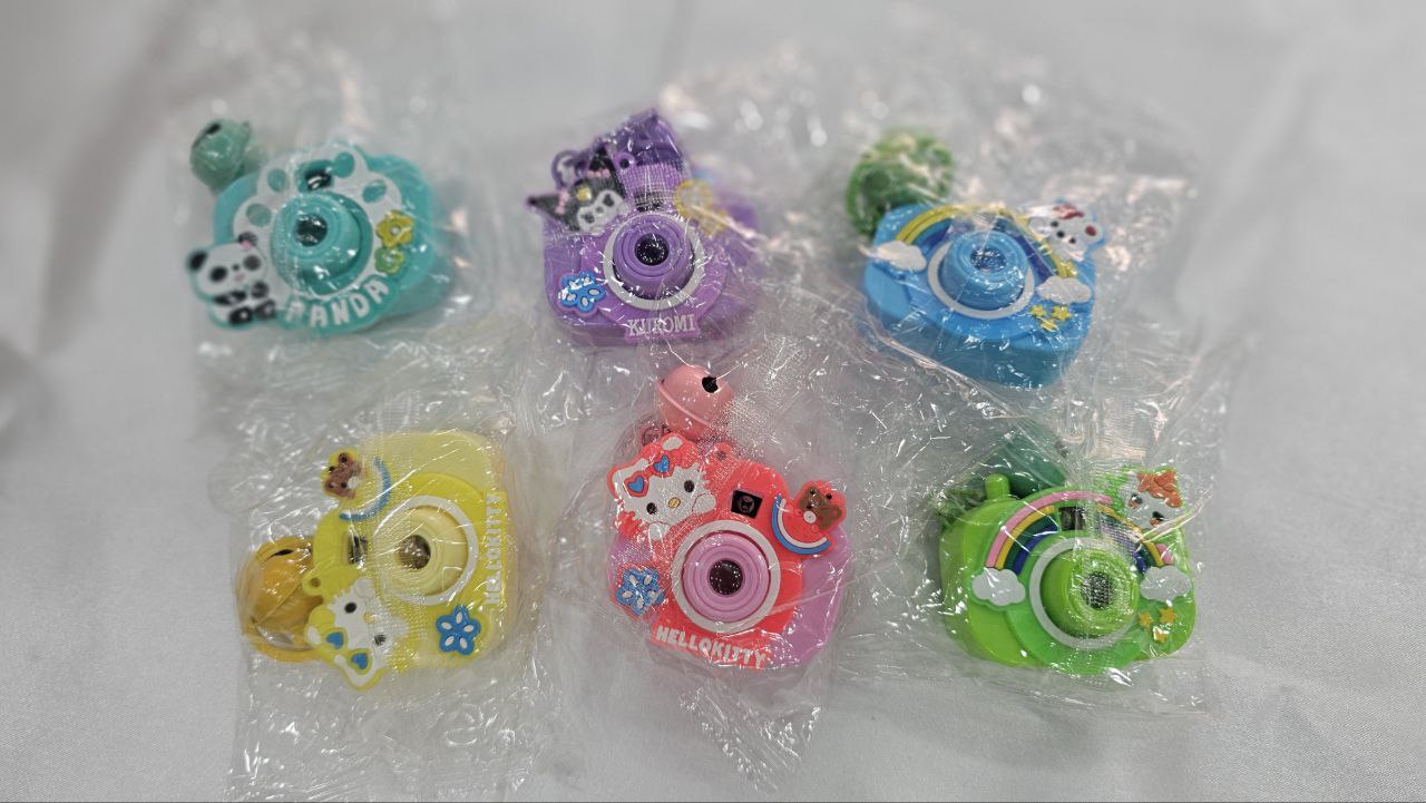 Mini Camera for Kids Projector Camera Toy with Bell for Kids and Girls Style Multicolor Design, Light Projection Feature Fun Cartoon Keychain for Bags, Pouches & Gifting (Random Color) (Pack of 1)